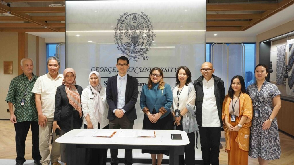 A group of people standing in front of the Georgetown label